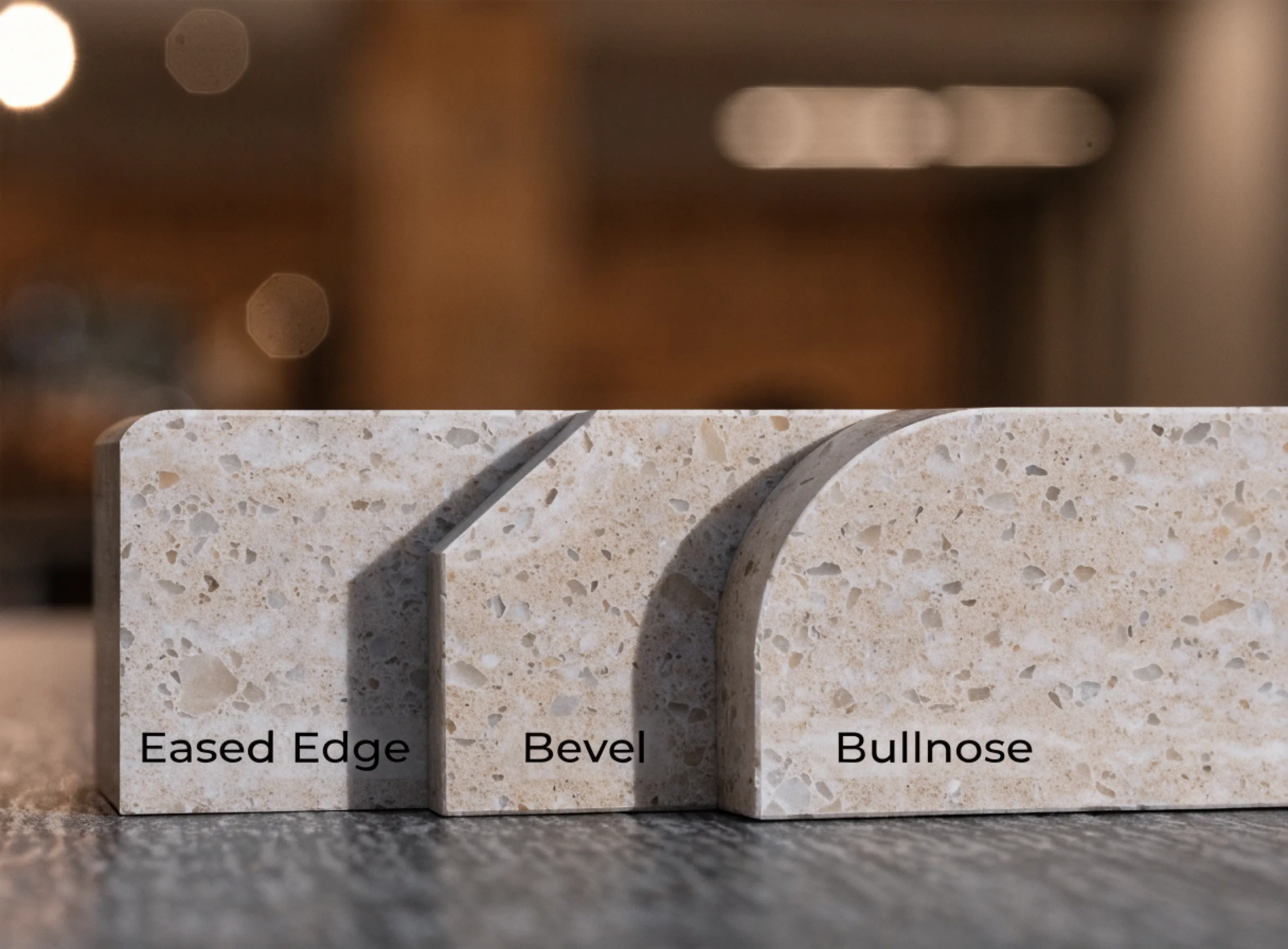 Three quartz edge profiles side by side on a sample, an eased edge, a bevel and a bullnose