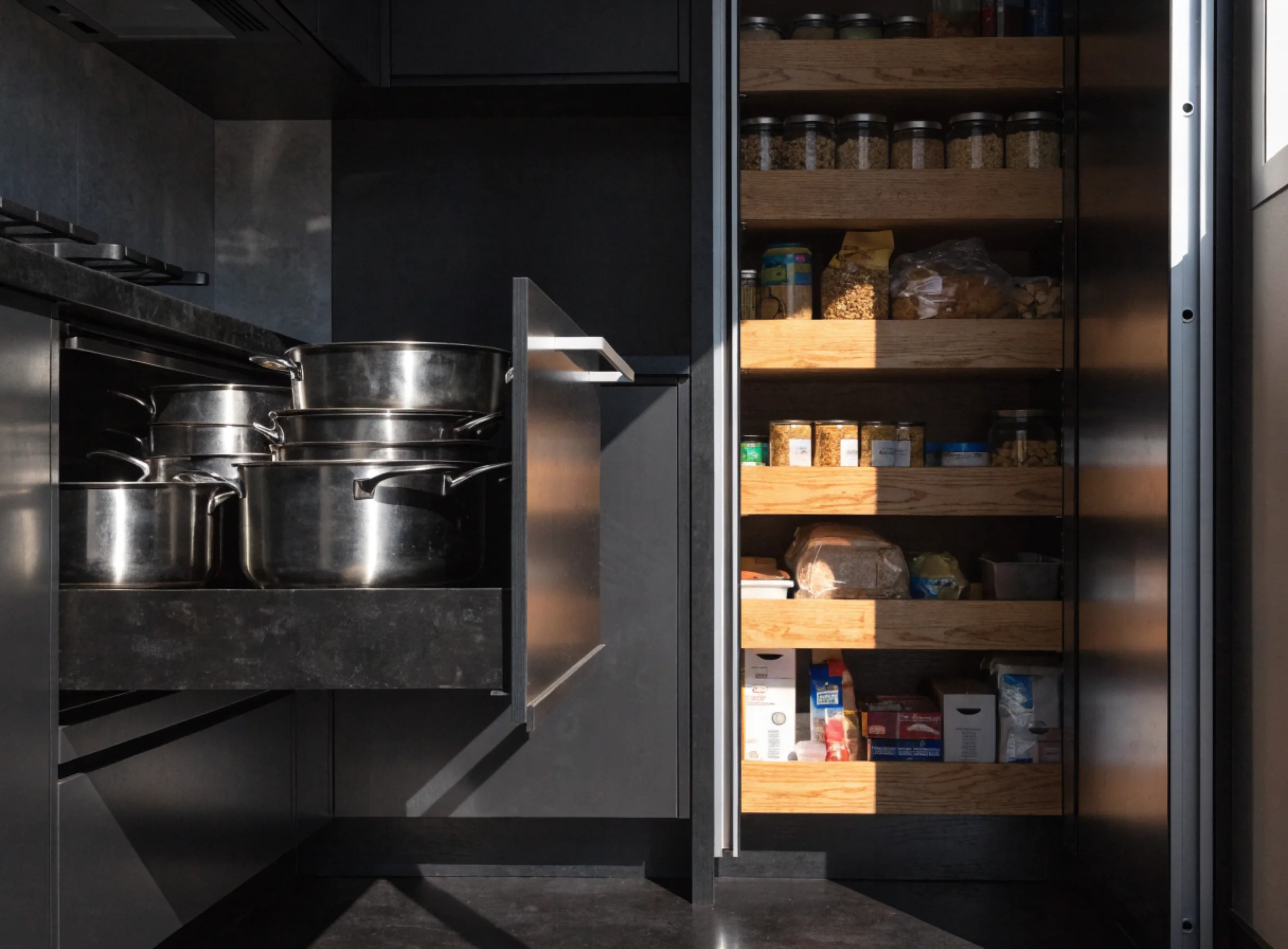 Deep drawers and a tall pull out pantry in a narrow kitchen, using the full height of the wall